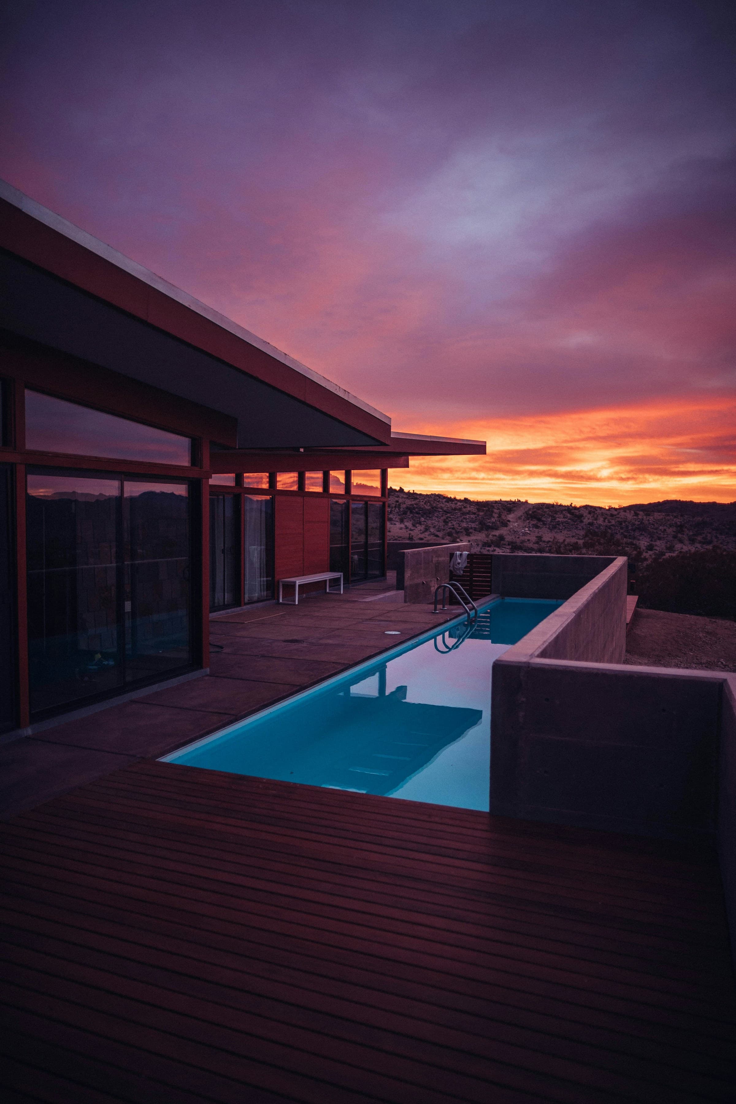 Modern Arizona desert home with pool at sunset